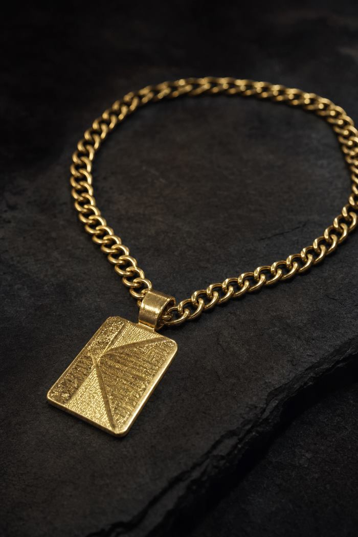 Studio result: macro of the gold pendant on dark slate