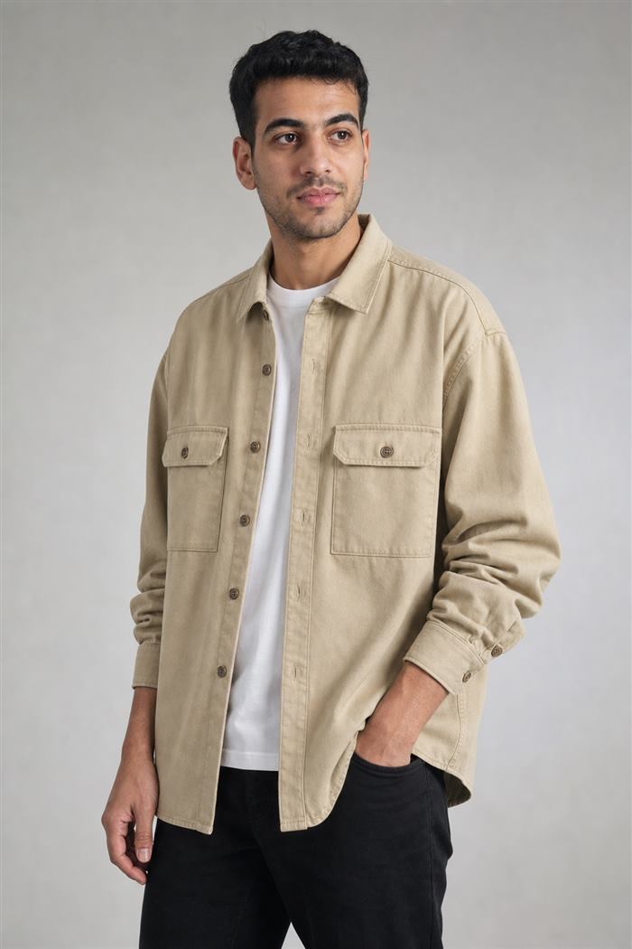 Studio result: the overshirt worn open over a white t-shirt on a grey backdrop